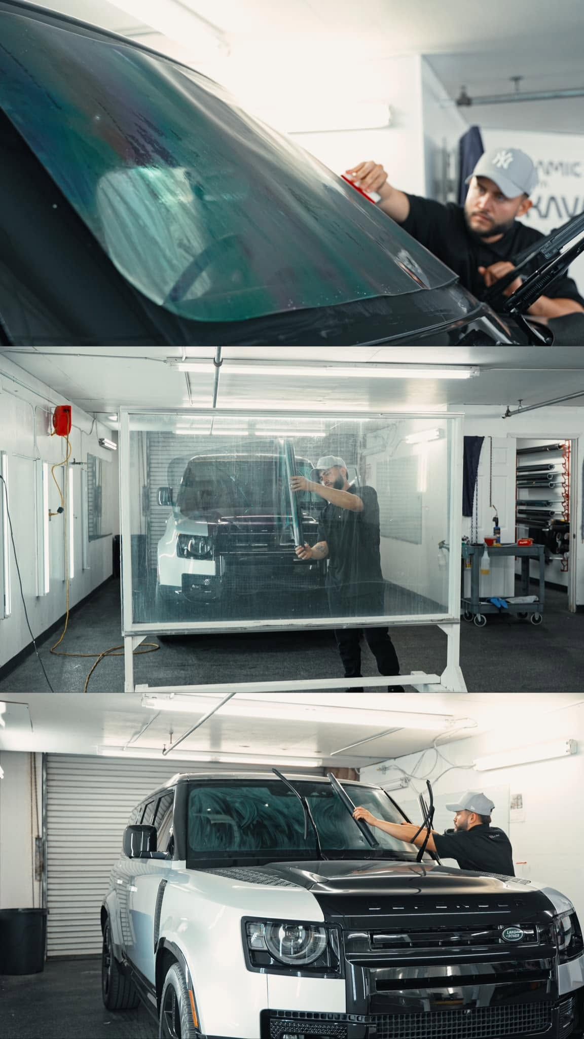 Car detailer cleaning a white SUV’s windshield and hood in a bright auto workshop