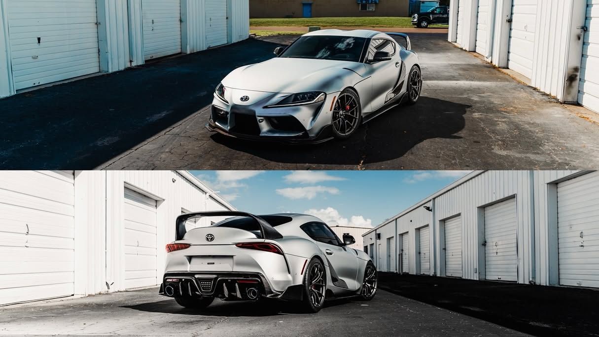 Silver sports car in an alley between white garages, shown from front and rear angles.