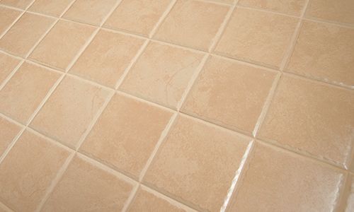 A close up of a tiled floor in a bathroom.