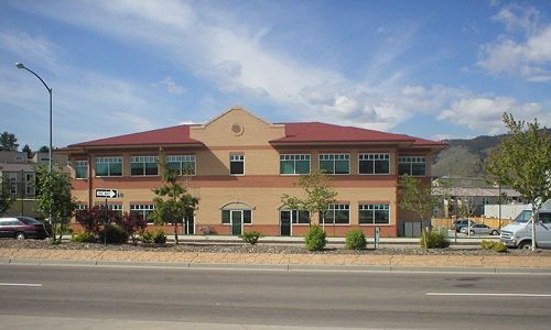 A large building with an arrow pointing to the right