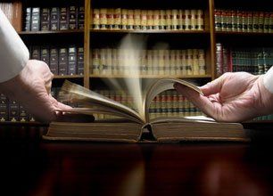 Lawyer opening a law book