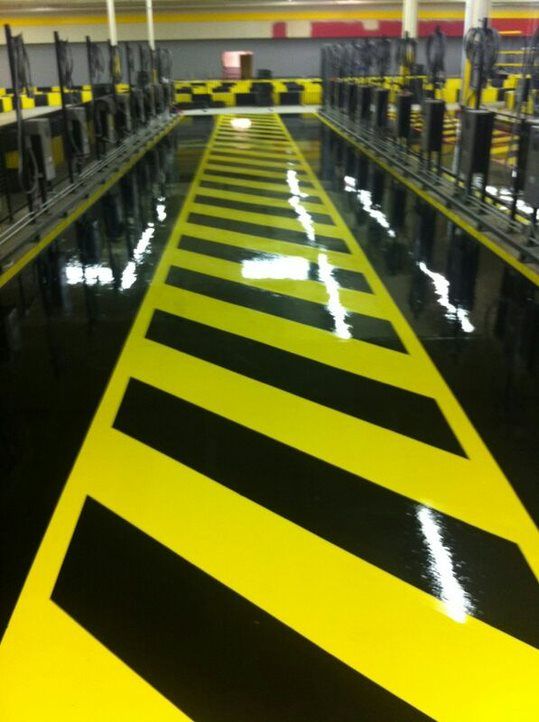 A yellow and black striped floor in a building