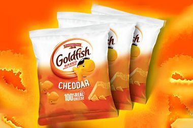 Three bags of goldfish cheddar chips are sitting on top of each other on a yellow background.