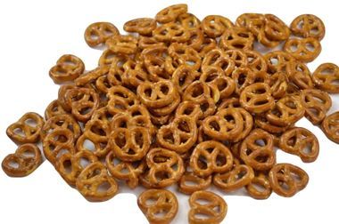 A pile of salted pretzels on a white background.