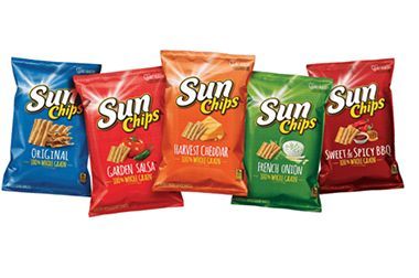 Four bags of sun chips are lined up next to each other on a white background.