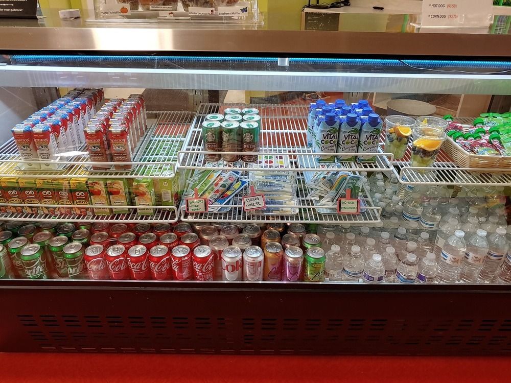 A refrigerator filled with lots of drinks and juices.