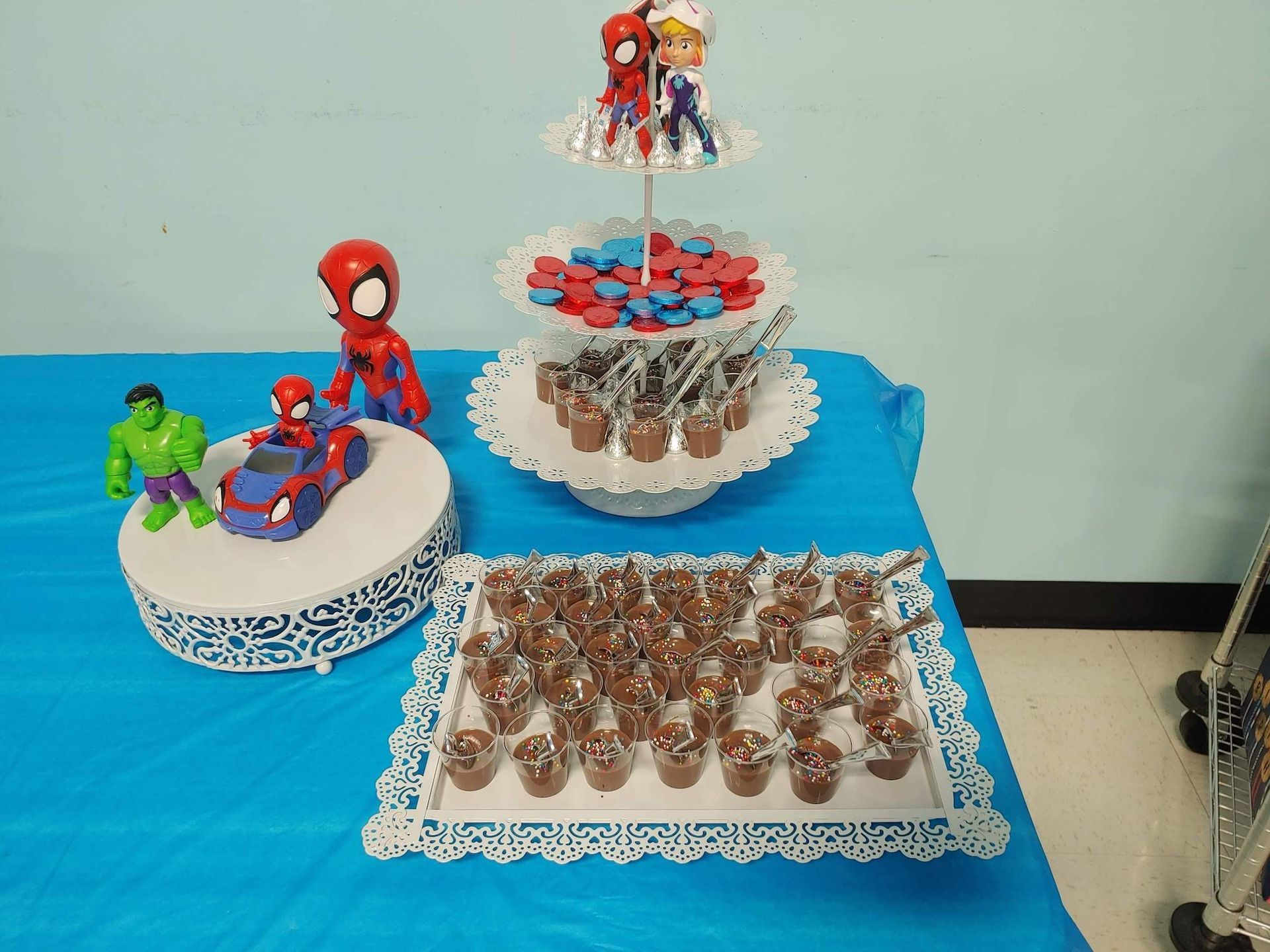 A table with a bunch of cupcakes on it