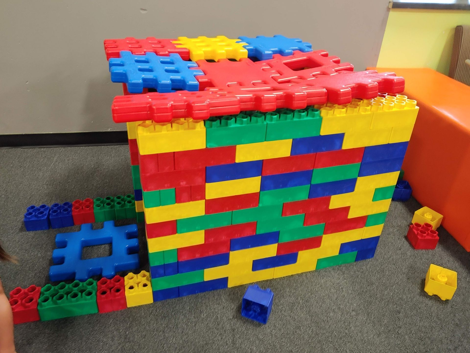 A bunch of colorful lego blocks are stacked on top of each other