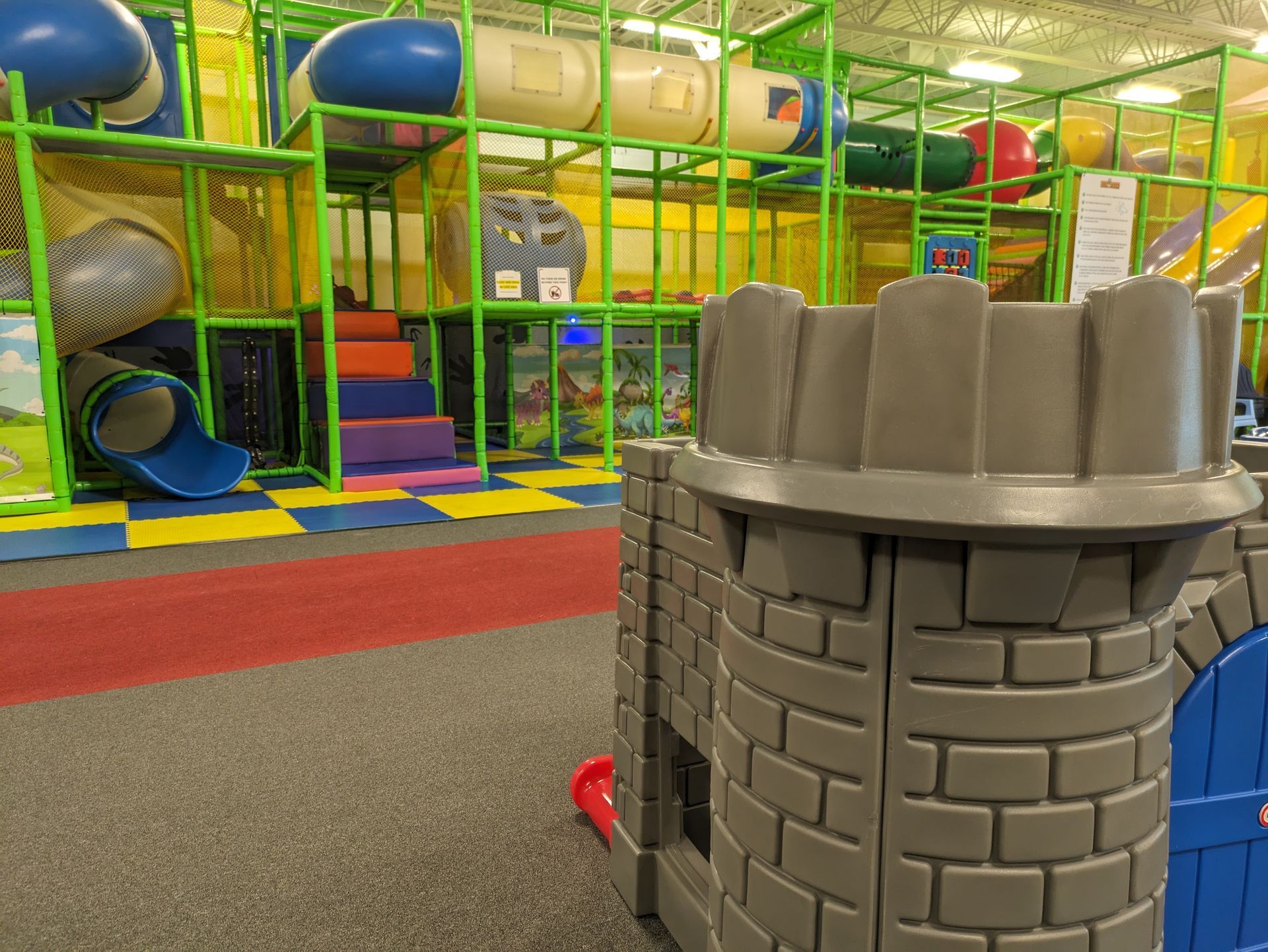 There is a castle in the middle of a playground.