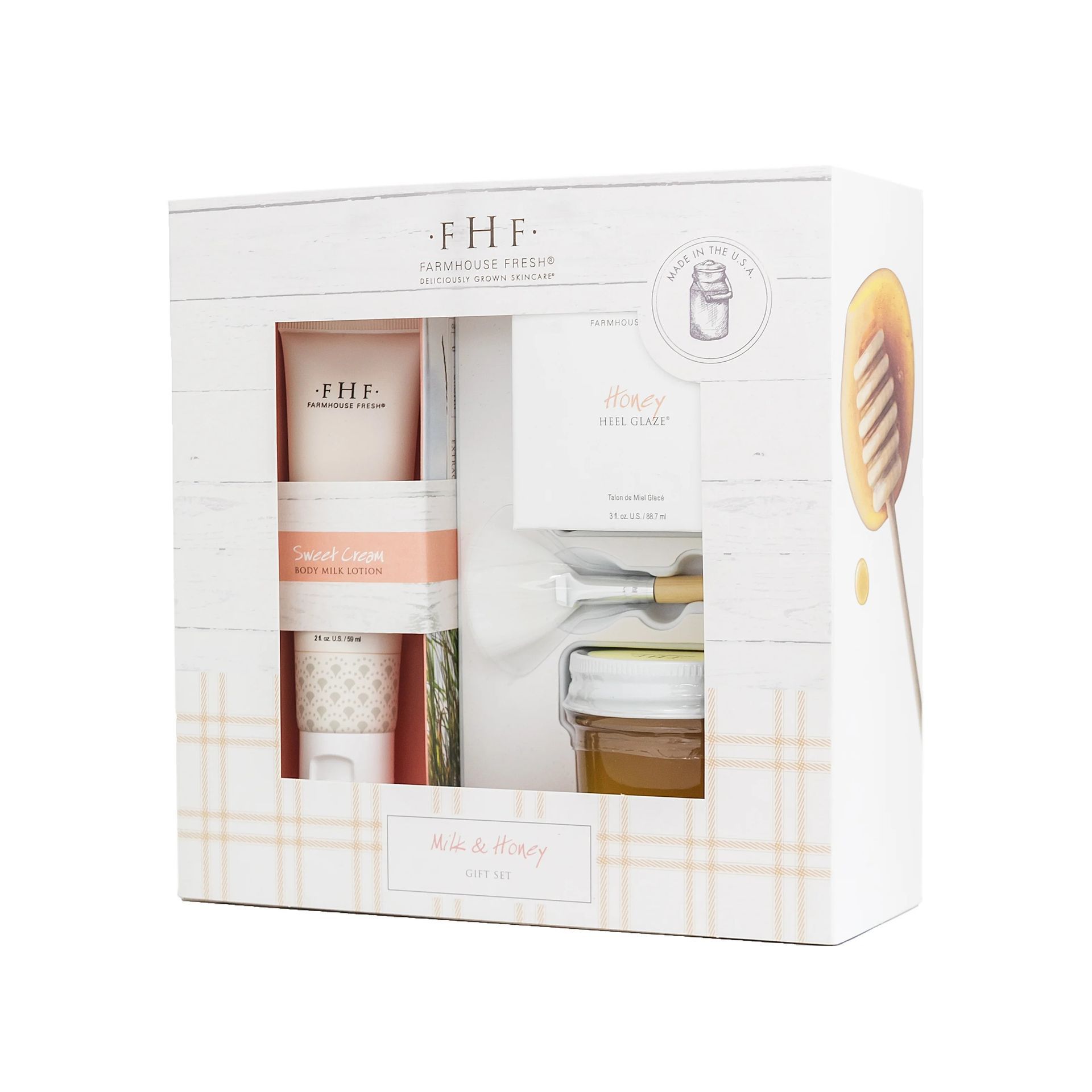 Gift box with honey jar, dipper, lotion, and soap. White and pink colors with a honey theme.