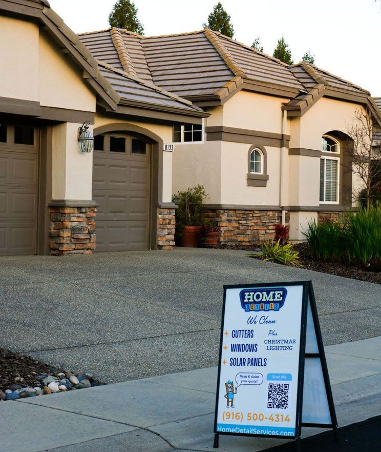 Suburban house with a for-sale sign in the driveway.