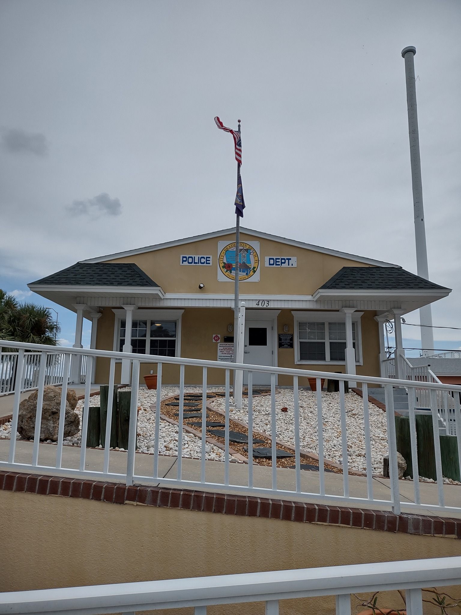 A small building with a flag on top of it