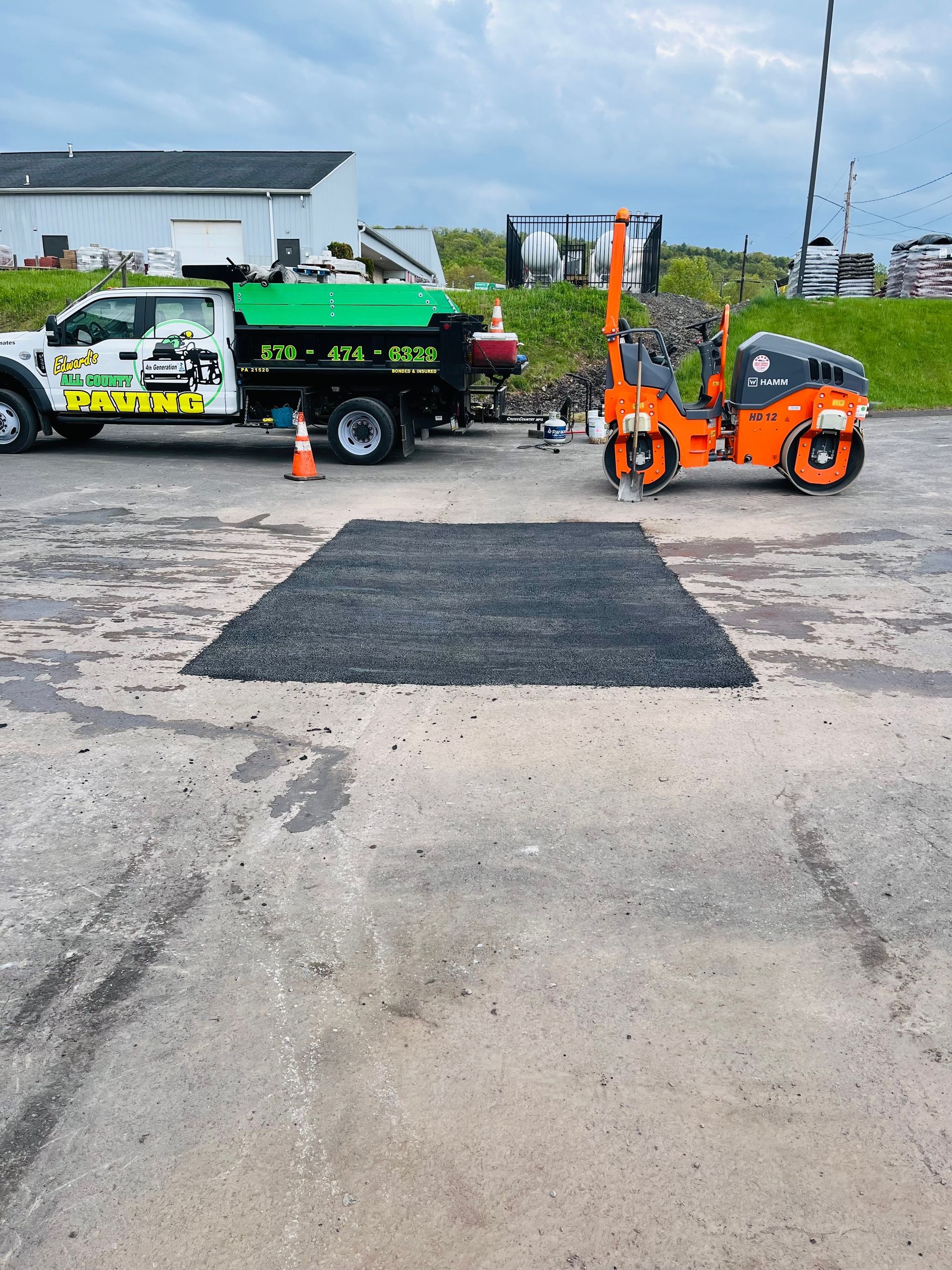 A truck that has the word asphalt on it.