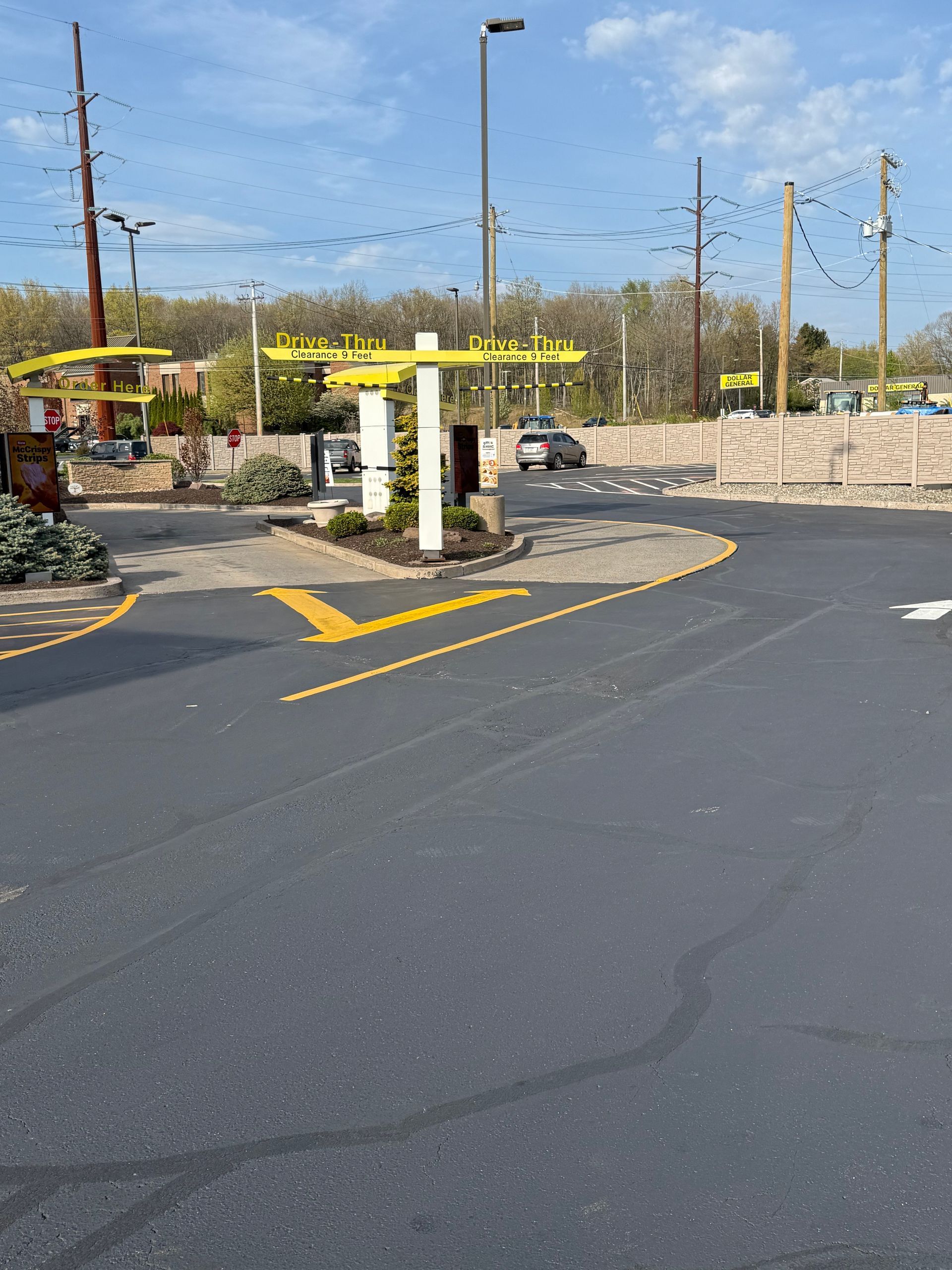 A parking lot with a yellow sign.