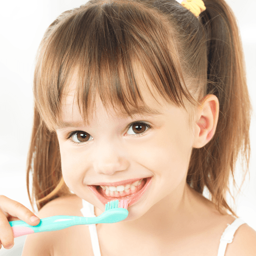 little girl brushing teeth