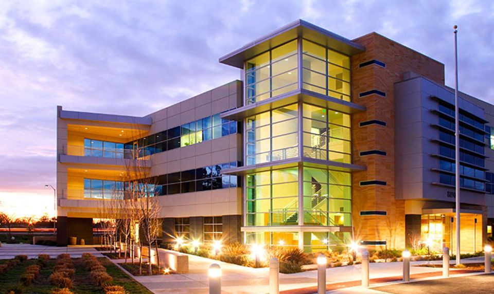 An office building with a empty parking lot