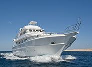 Large luxury motor yacht under way out at sea