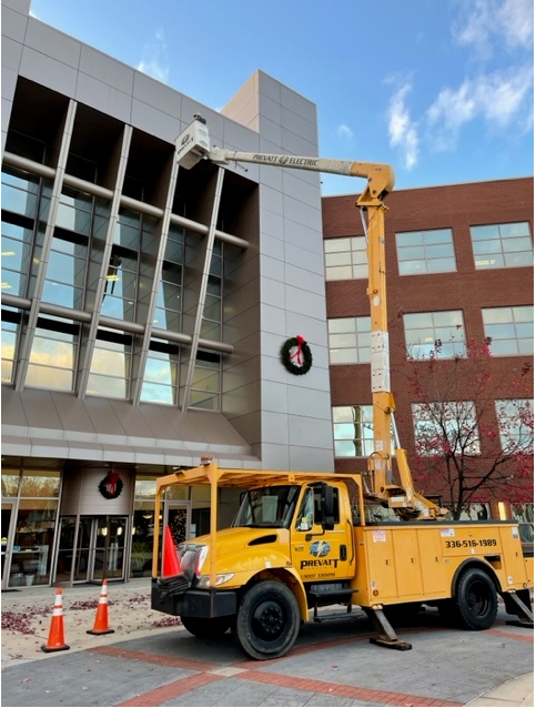 Yellow-Bucket-Truck-Fixing-Building