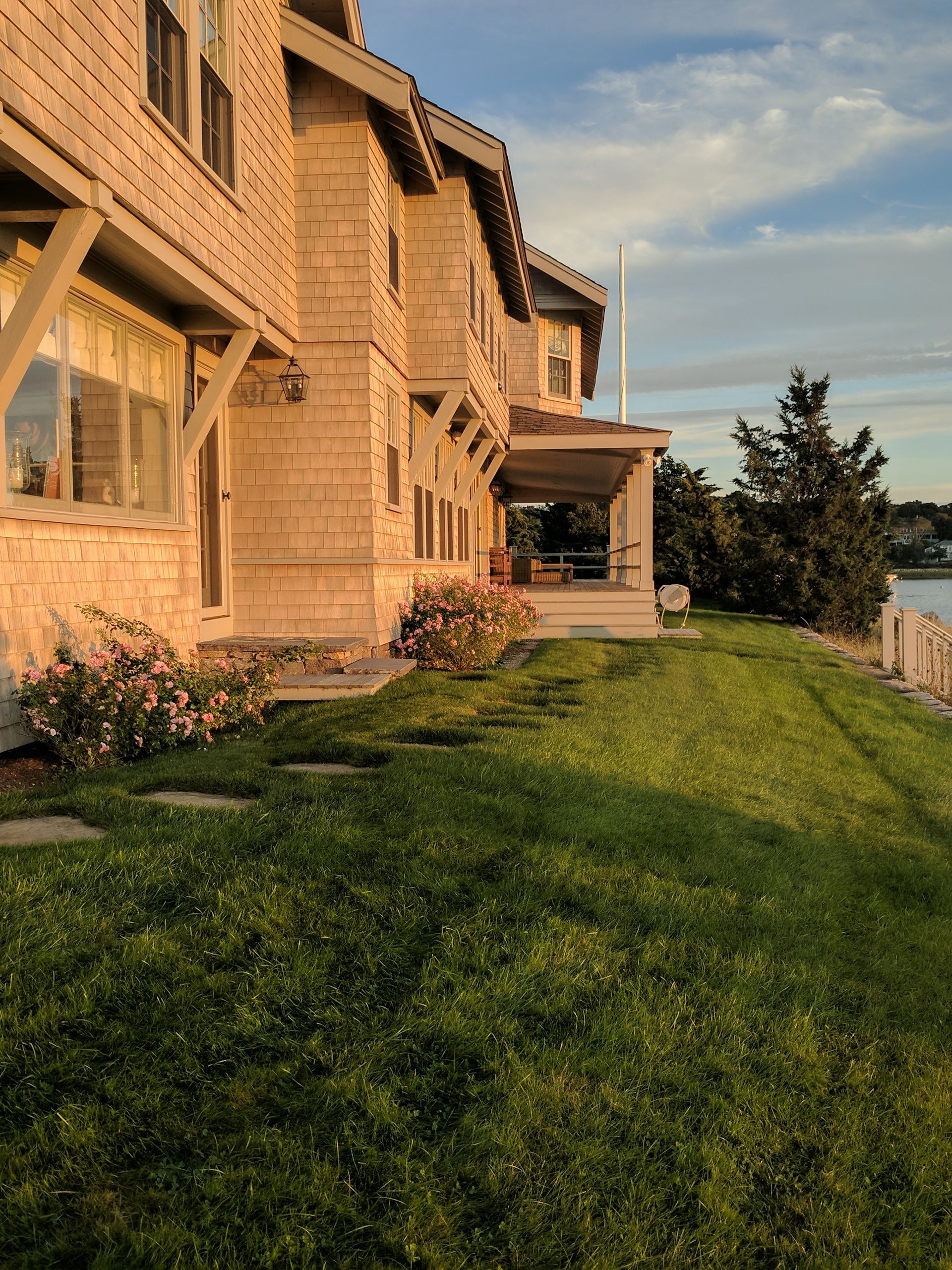 A large house with a large lawn in front of it