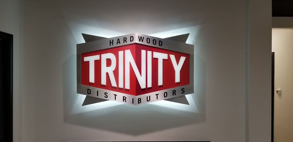 A sign that says Trinity Hardwood distributors on it