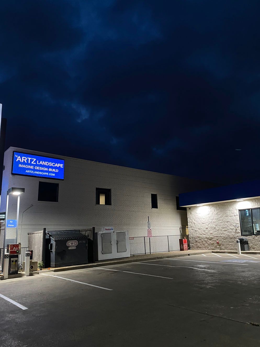 A building with a blue sign 