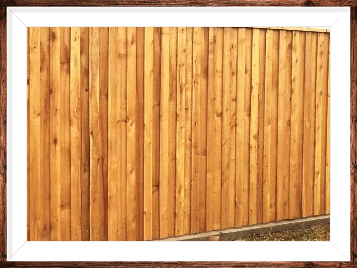 A picture of a wooden fence in a wooden frame.