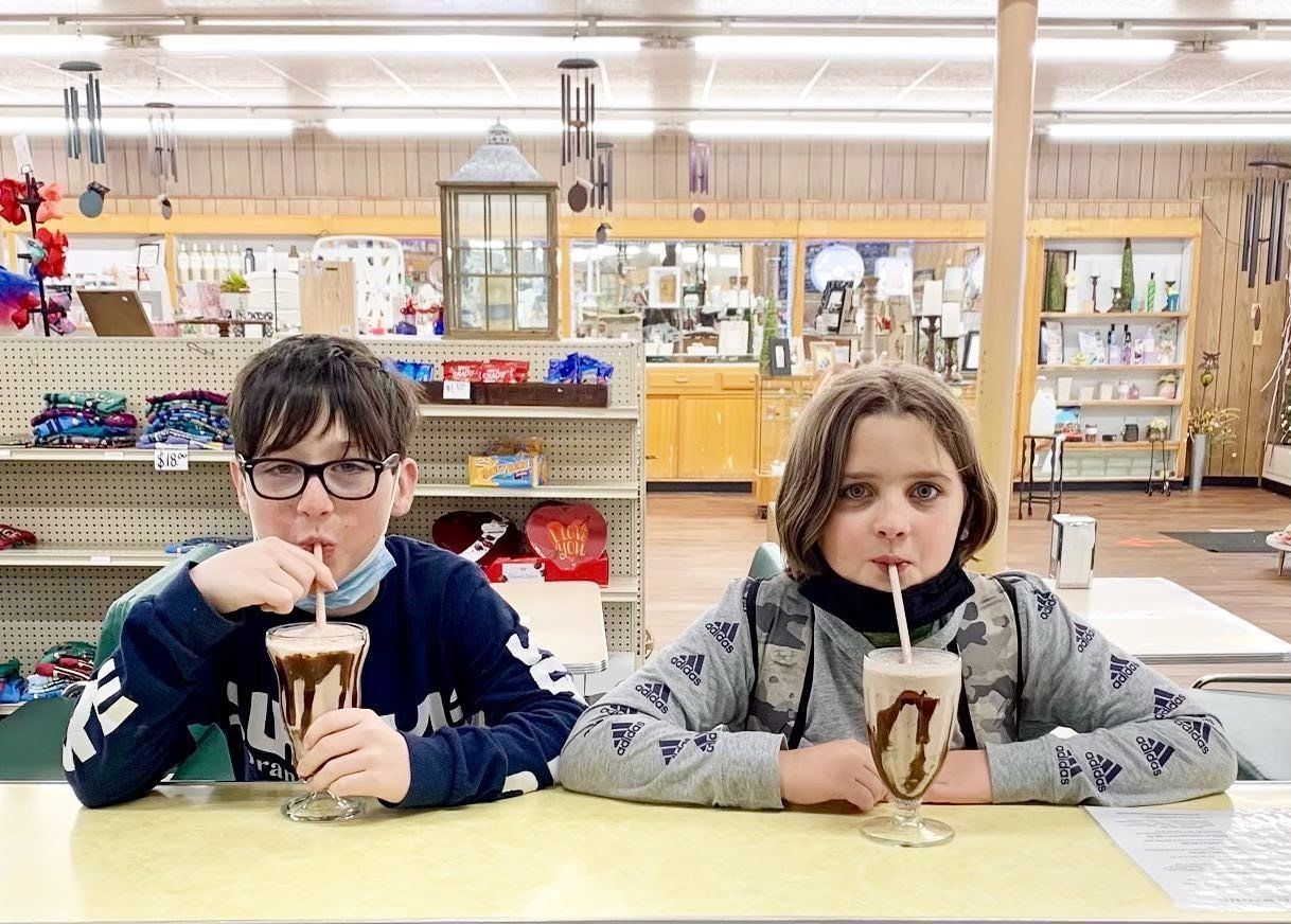 Two Kids Enjoying Delicious Ice Cream