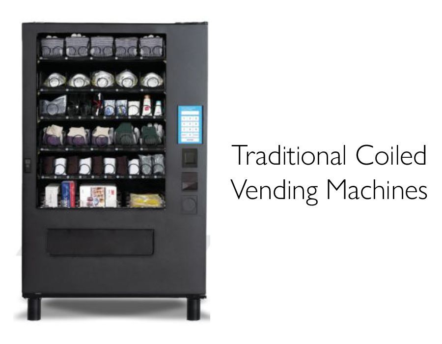 Black snack vending machine with illuminated keypad and snacks visible, labeled “Traditional Coiled Vending Machines”