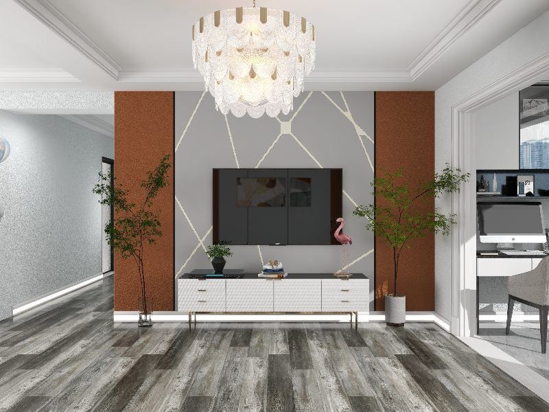 A living room with a television on the wall and a chandelier hanging from the ceiling.