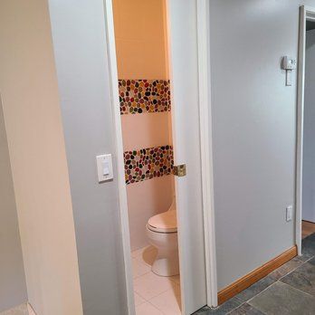 A bathroom with a sliding door