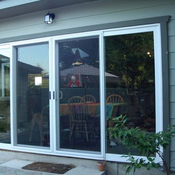 A house with a closed sliding glass door 
