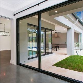 A large sliding glass door leading to a patio in a house