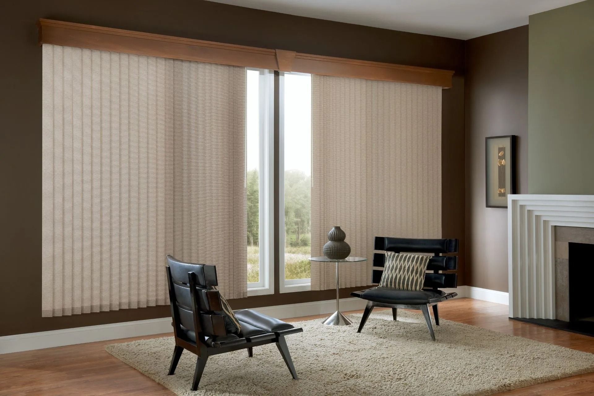 Modern living room featuring two black lounge chairs on a beige rug, with large vertical blinds covering a bright window.