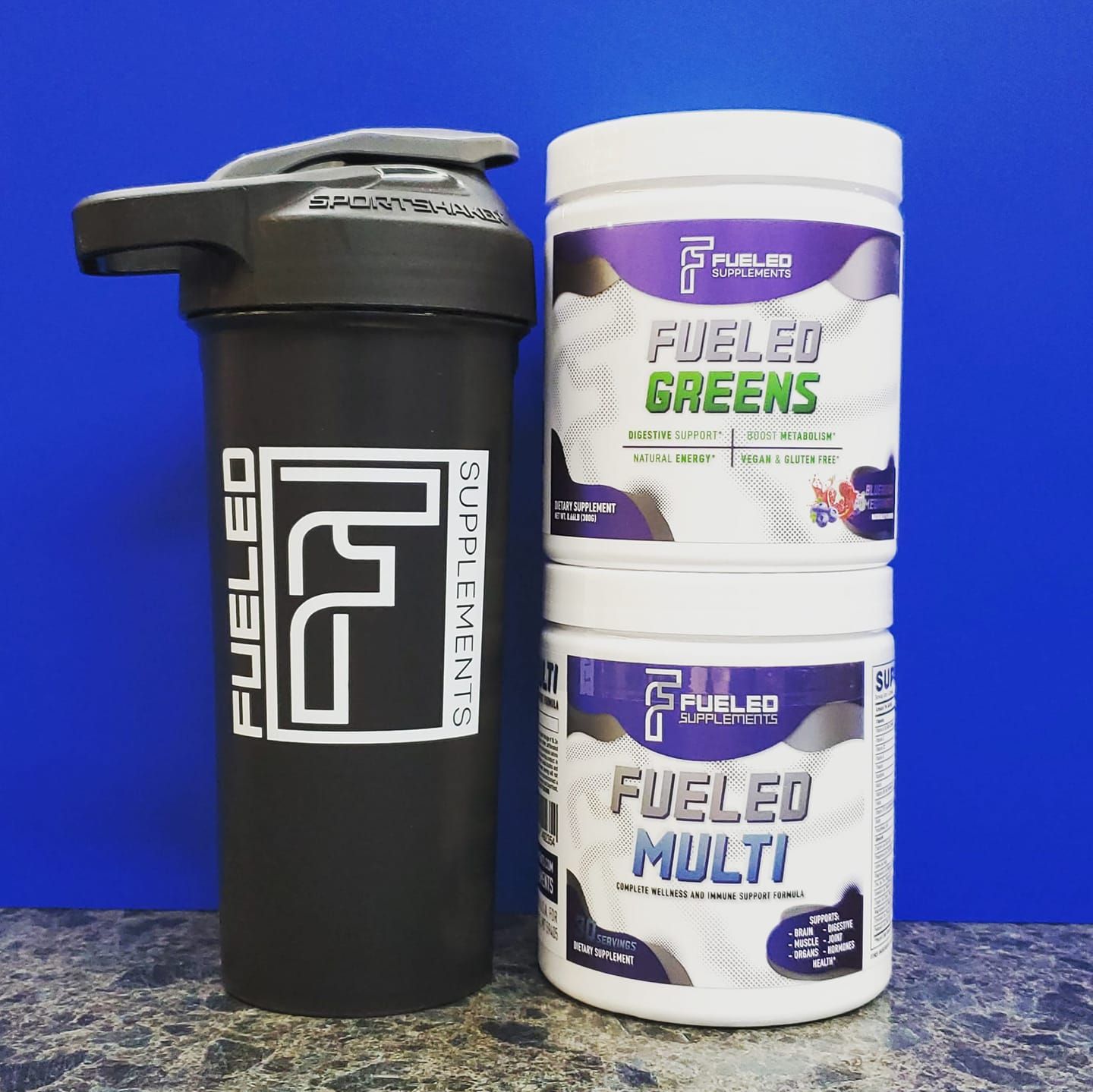 A bottle of fueled greens next to a bottle of fueled multi