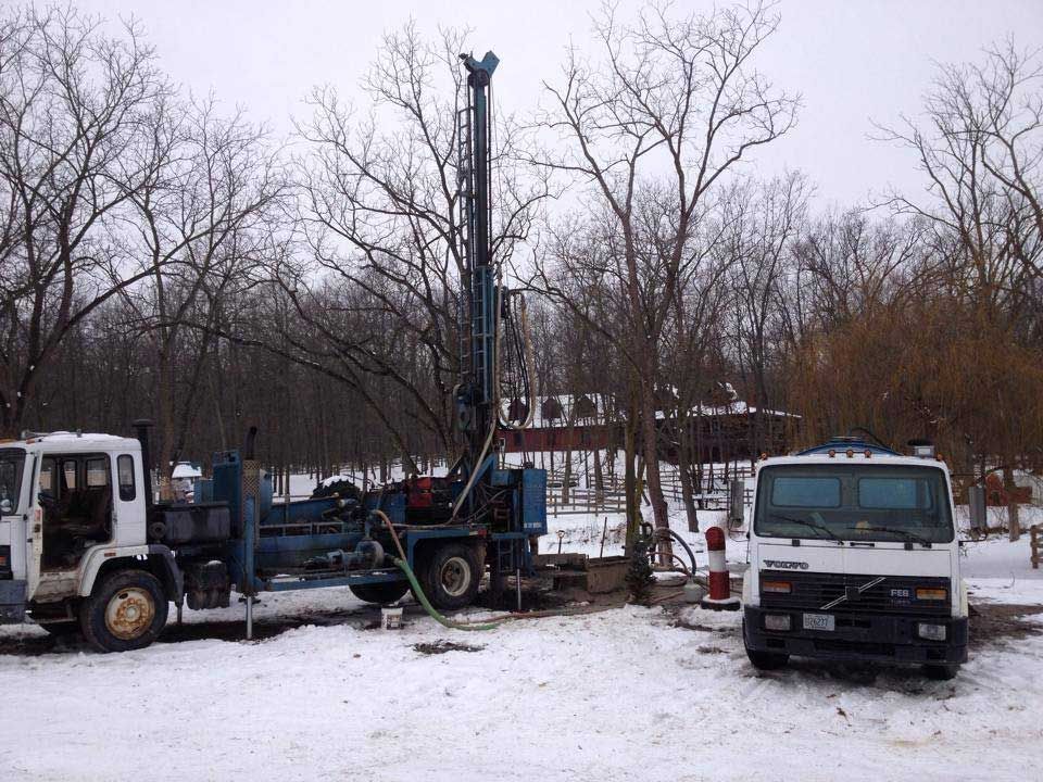 two trucks are parked next to each other in the snow