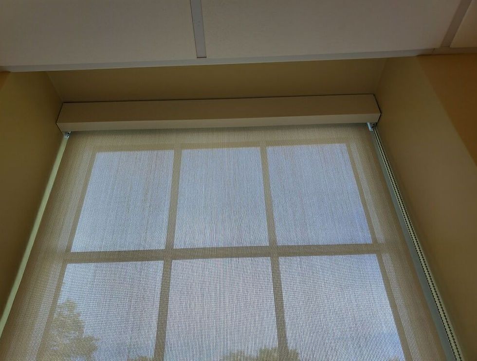 A window with a blind on it and a reflection of the sky