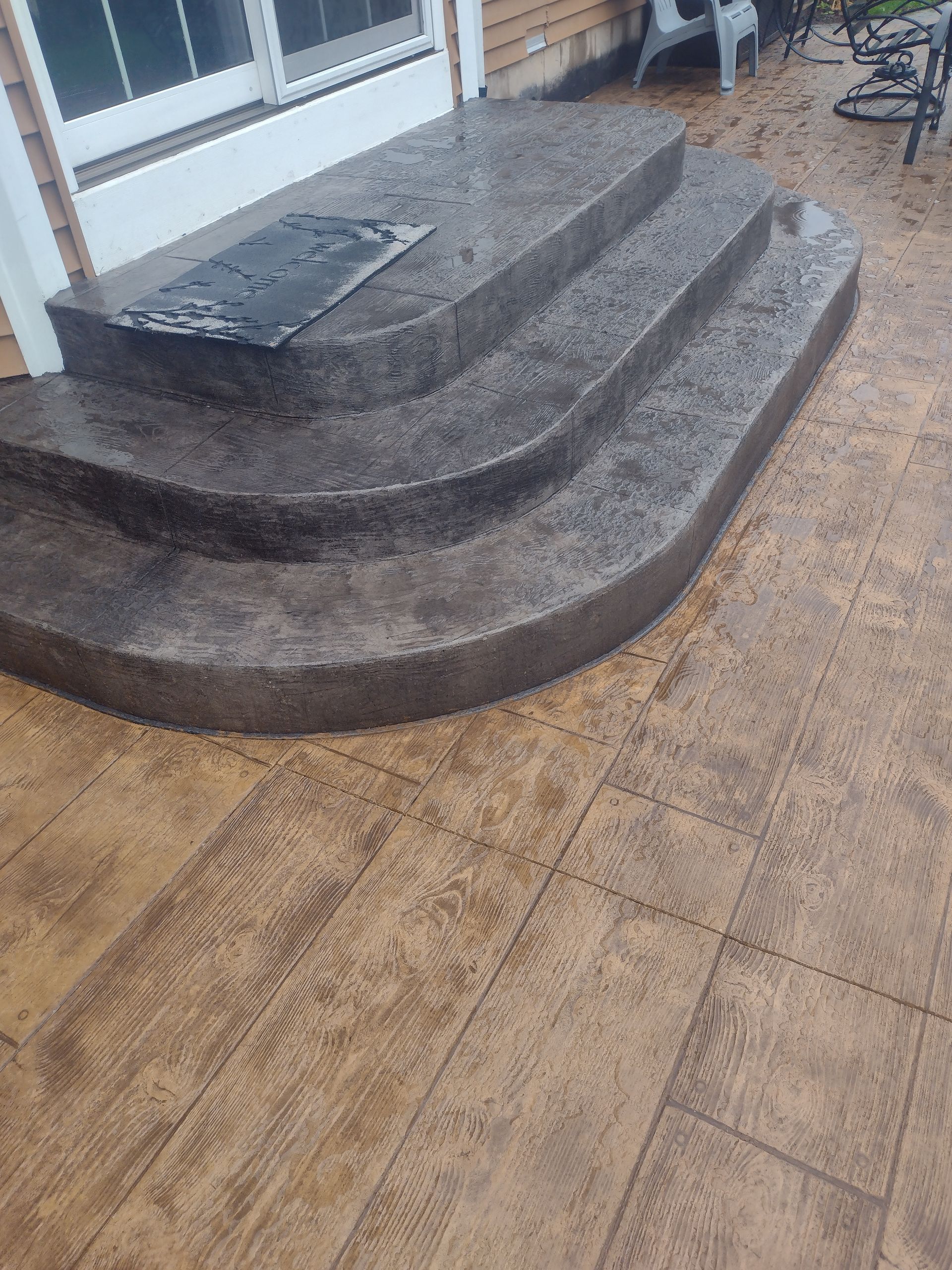 A set of concrete steps leading up to a house.