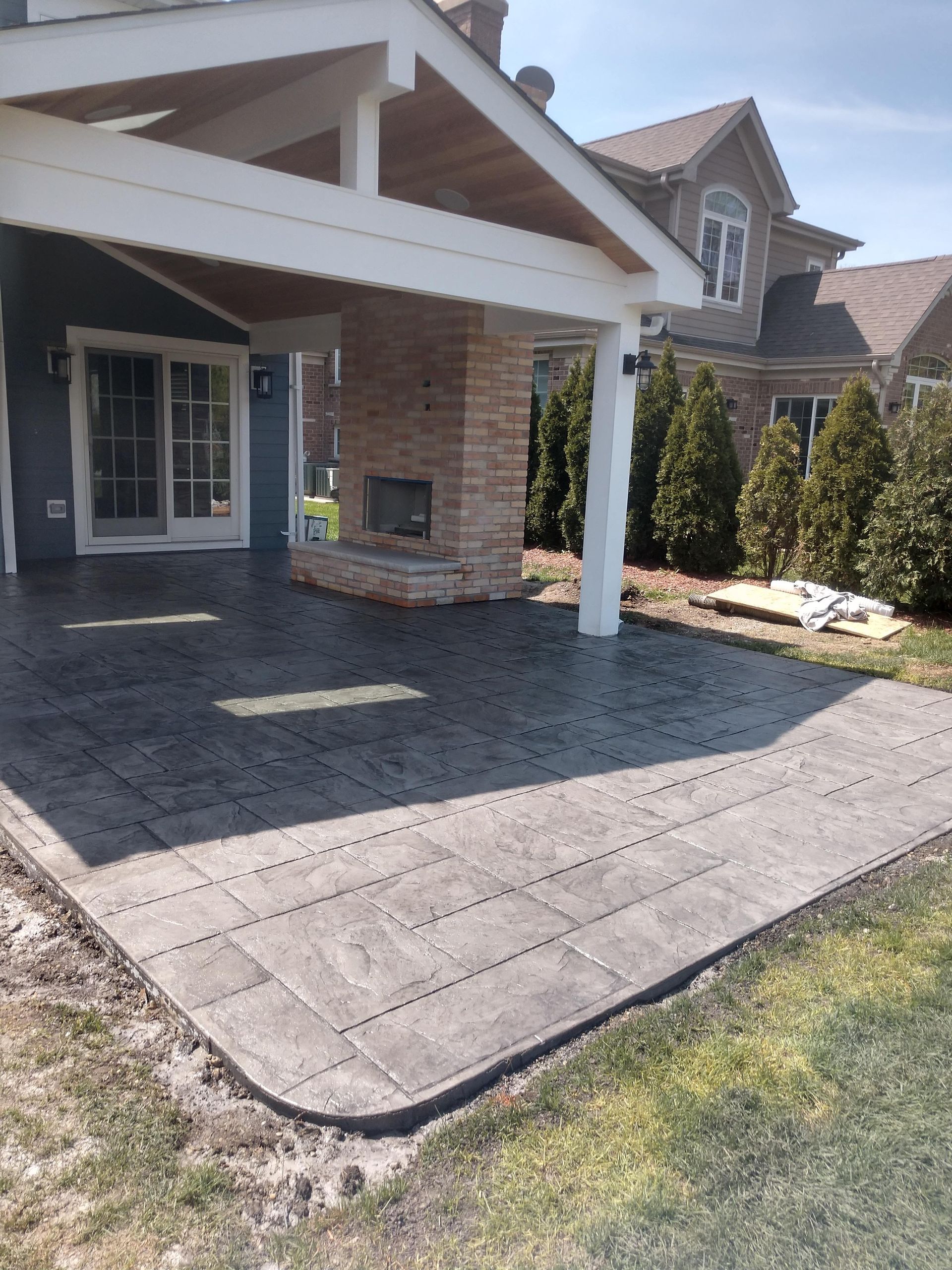 A house with a covered patio in front of it