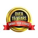A gold badge with a red ribbon that says over 15 years garage door service.