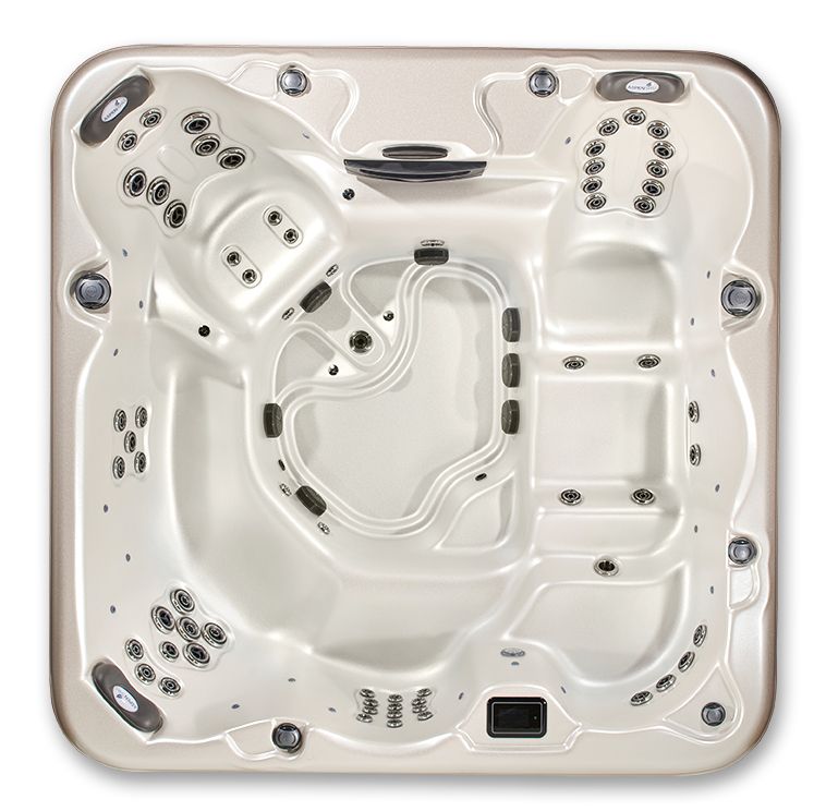 Overhead view of an empty square hot tub with integrated seating and numerous water jets, featuring a cream-colored basin.