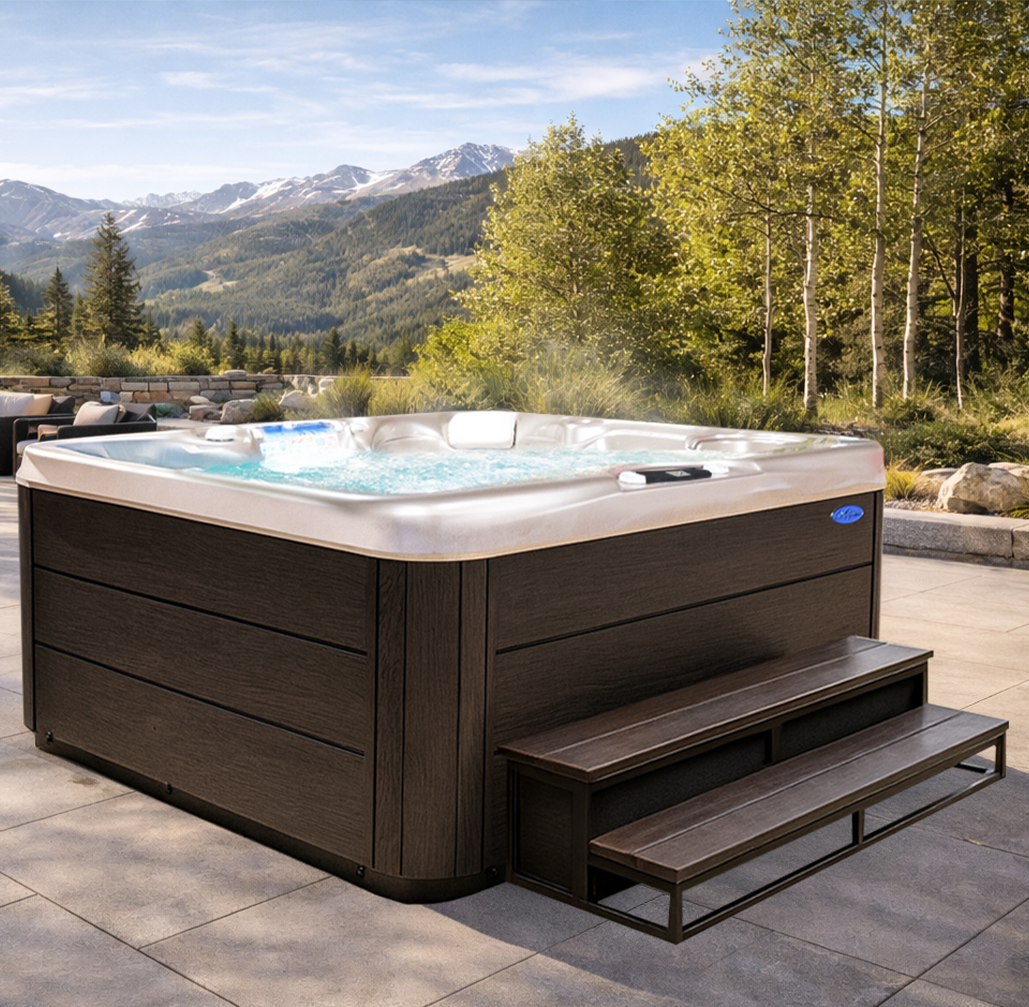 Outdoor hot tub with steps on a scenic mountain deck