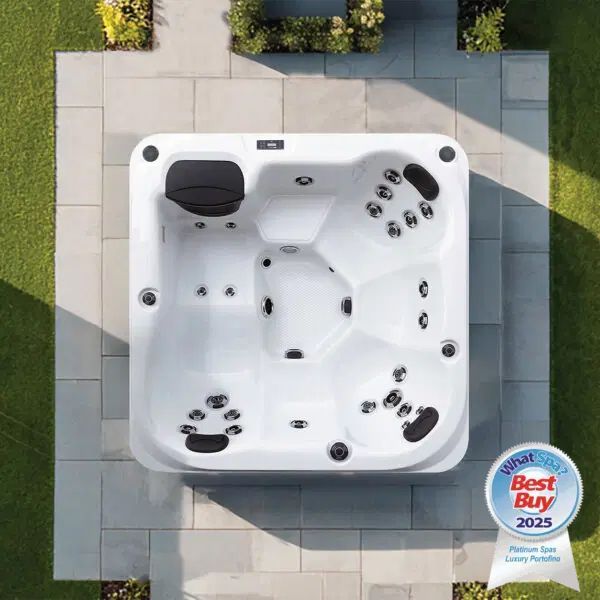 Top-down view of a white square hot tub on a grey stone patio, featuring a 2025 Best Buy award badge in the corner.