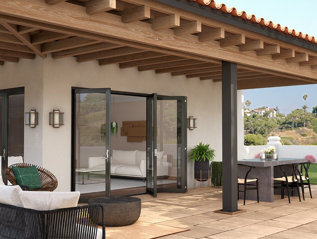 An artist 's impression of a patio with a couch , table and chairs.