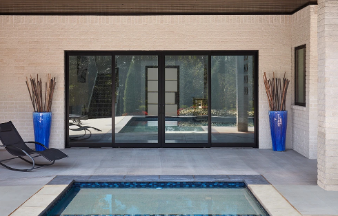 glass sliding doors to the pool area