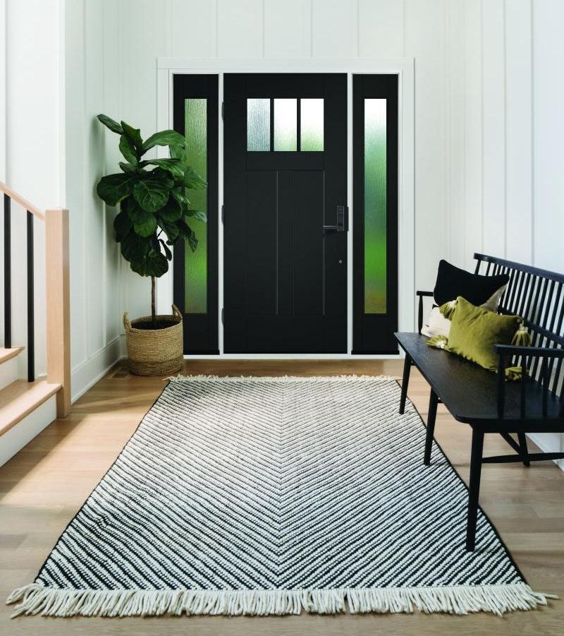 There is a black door in the middle of the room.