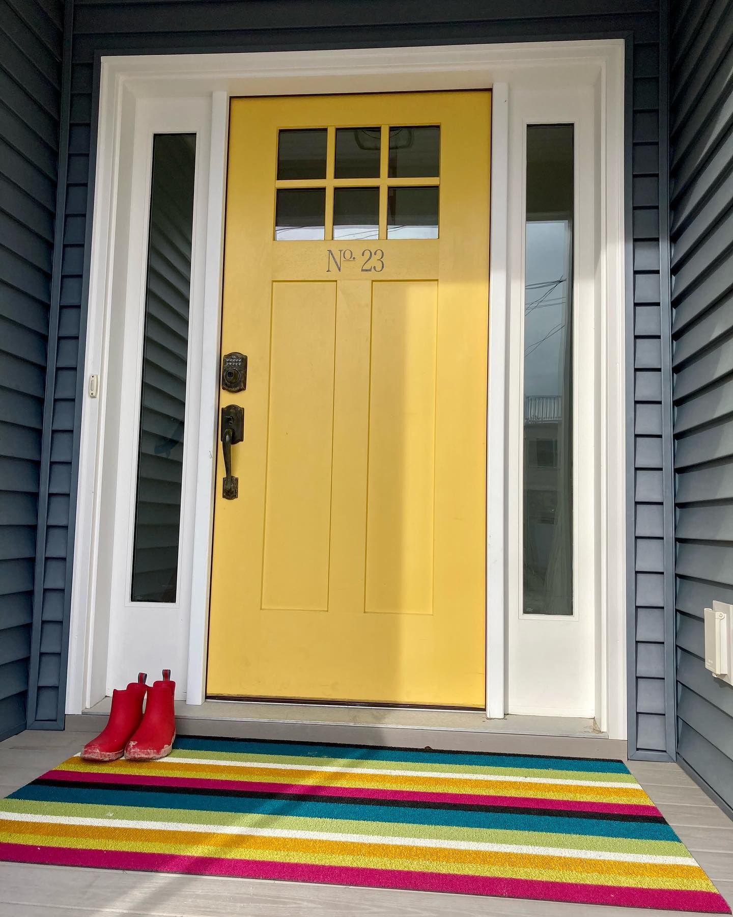 A yellow door with the number 23 on it