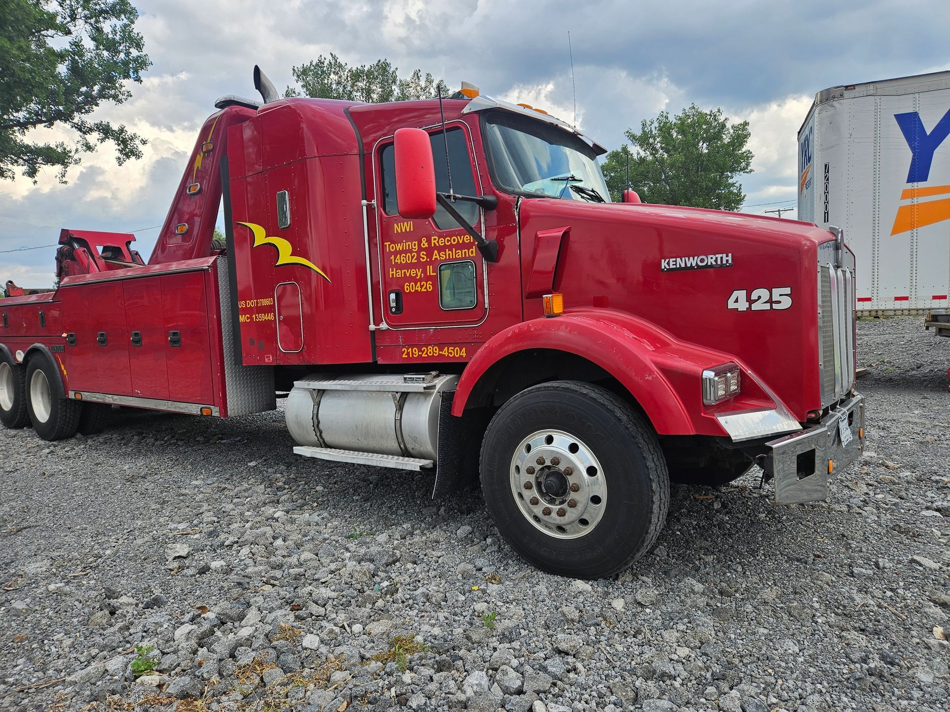 A red tow truck with the number 425 on it