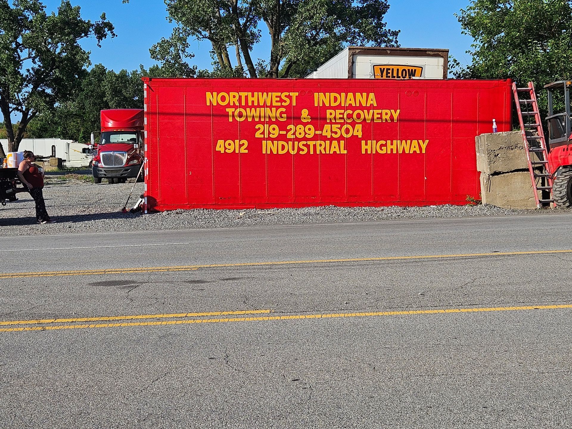 A red container that says northwest indiana towing & recovery on it