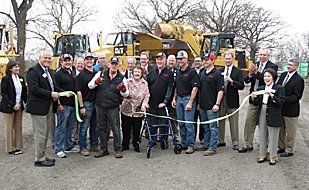Ken Rasch along with wife, cut 70 years ribbon.