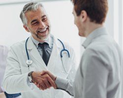 Doctor handshake with a patient